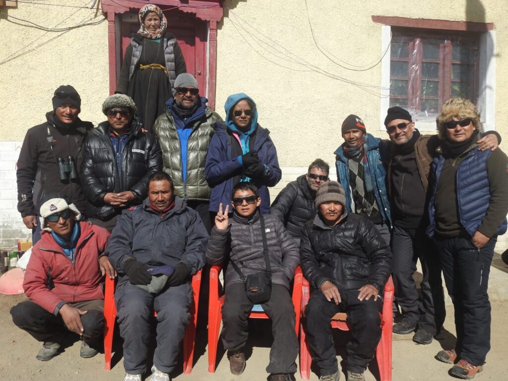 Our group at Ulley village with the land lady on top.